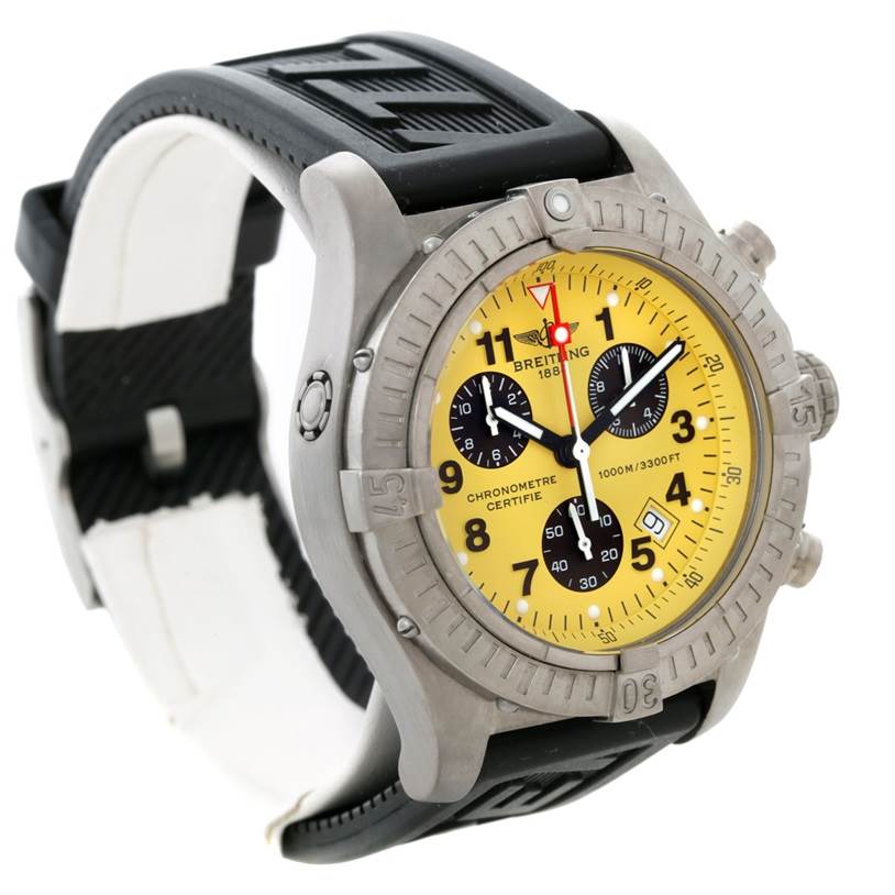 The image shows a Breitling Avenger E73360 Men's Titanium Yellow Dial E73360 Men's Titanium Yellow Dial watch at a slight side angle, highlighting its yellow dial, black strap, and chronograph features.