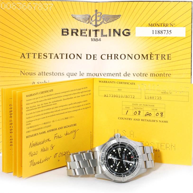 The image shows a Breitling Superocean A17390 Men's Stainless Steel Black Dial A17390 Men's Stainless Steel Black Dial watch with its warranty certificate and chronometer attestation from a slightly elevated angle.
