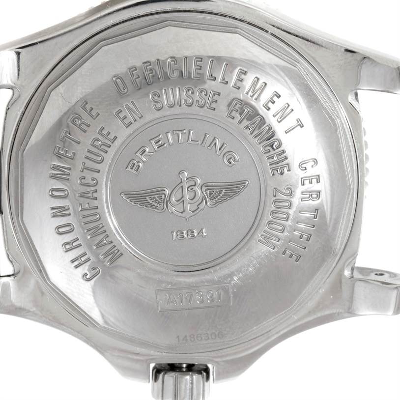 The image shows the back case of a Breitling Superocean A17391 Men's Stainless Steel Black Dial A17391 Men's Stainless Steel Black Dial watch, highlighting its engravings and branding.