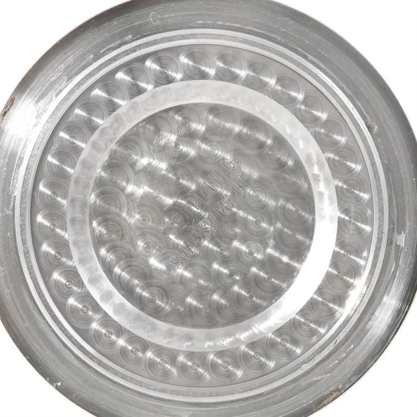 This is the inner side, or case back, of a Breitling Superocean A17391 Men's Stainless Steel Black Dial A17391 Men's Stainless Steel Black Dial watch, showing its intricate concentric pattern.