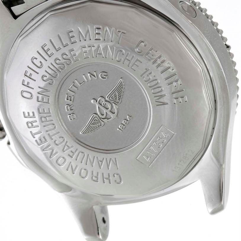 The image shows the back case of a Breitling Superocean A17364 Men's Stainless Steel Black Dial A17364 Men's Stainless Steel Black Dial watch at an angle, displaying inscriptions and the brand's logo.