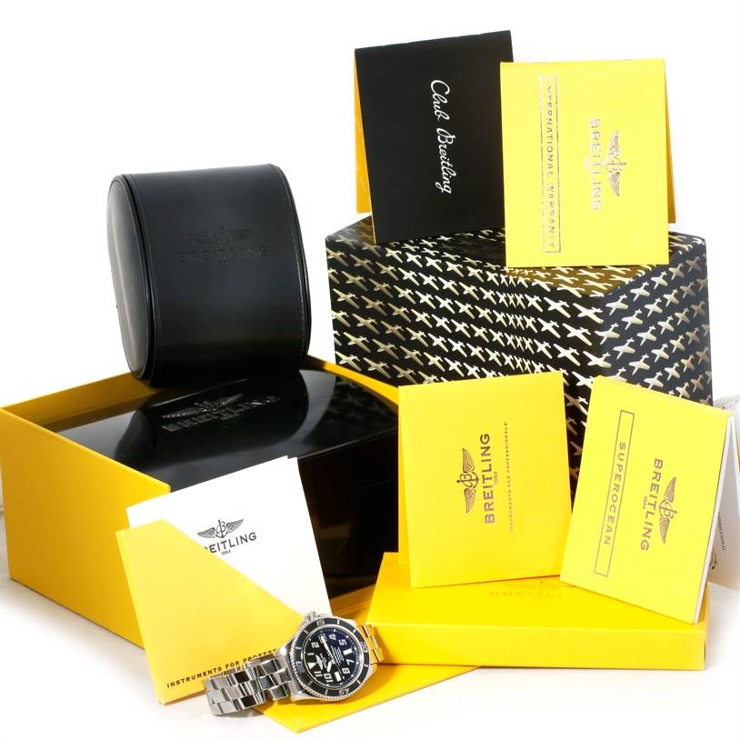 The image shows a Breitling Superocean A17364 Men's Stainless Steel Black Dial A17364 Men's Stainless Steel Black Dial watch along with its packaging, manuals, and accessories from a slightly elevated angle.