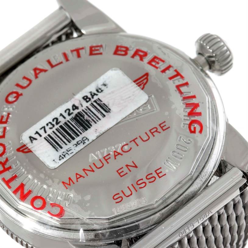 The image shows the back case and crown of a Breitling Superocean A17320 Men's Stainless Steel Black Dial A17320 Men's Stainless Steel Black Dial watch, including text and a barcode sticker.