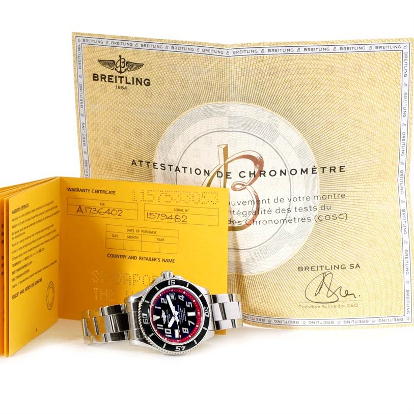The Breitling Superocean A17364 Men's Stainless Steel Black Dial A17364 Men's Stainless Steel Black Dial watch is shown alongside its warranty certificate and chronometer certification, photographed from the front.