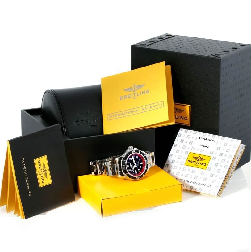 The image shows a Breitling Superocean A17364 Men's Stainless Steel Black Dial A17364 Men's Stainless Steel Black Dial watch and its accessories, including the box, warranty card, and manuals, viewed from a front angle.
