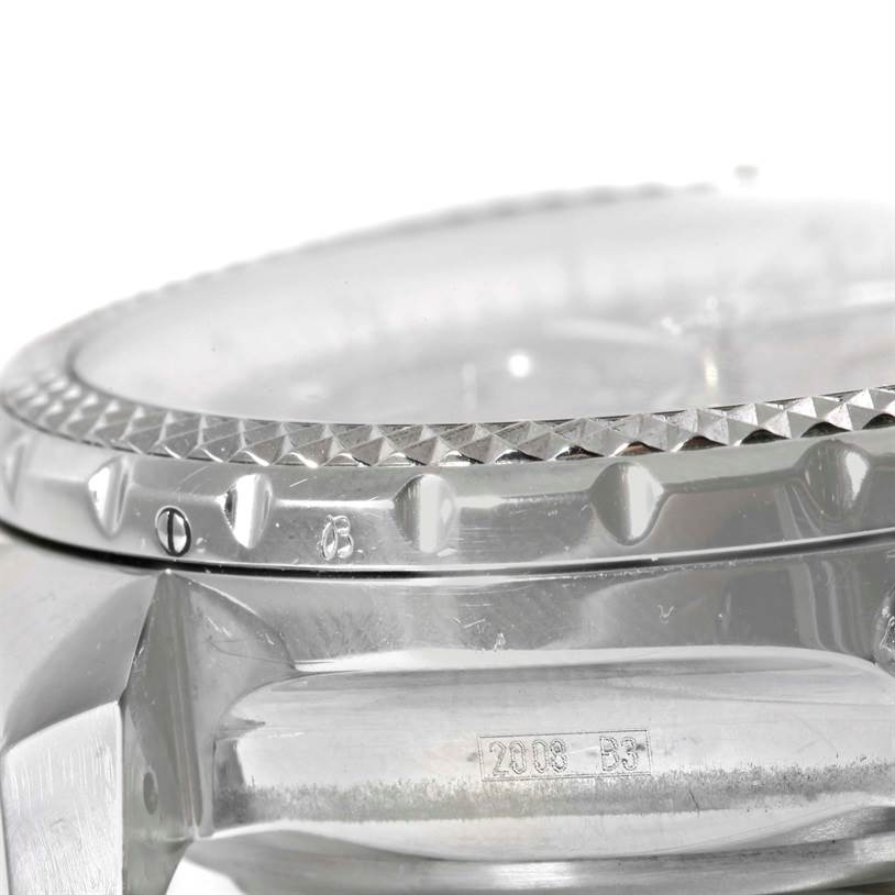 This image shows a close-up of the bezel and part of the case of the Breitling Bentley A44362 Men's Stainless Steel Brown Dial A44362 Men's Stainless Steel Brown Dial watch, highlighting its knurled edge and markings.