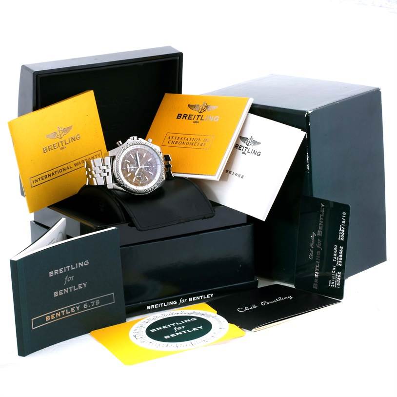 The image shows a Breitling Bentley A44362 Men's Stainless Steel Brown Dial A44362 Men's Stainless Steel Brown Dial watch at an angle, along with its box, warranty cards, and manuals.