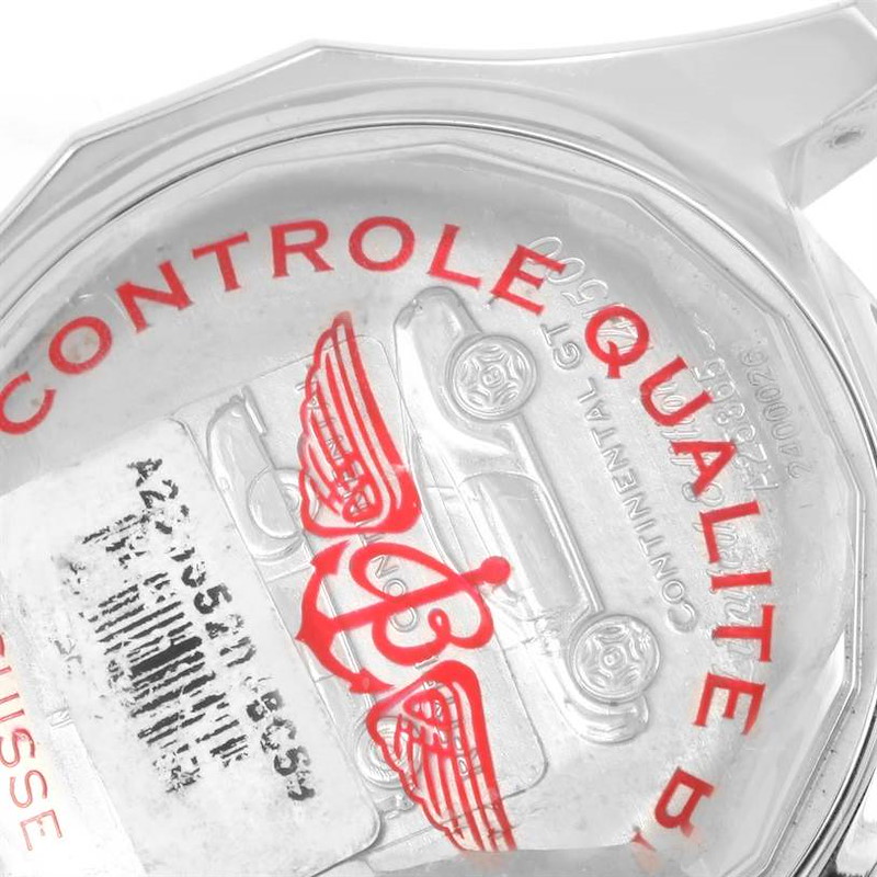 The image shows the case back of a Breitling Bentley watch, featuring both the brand and model engraving along with quality control markings.