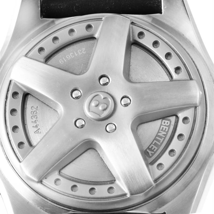 The image shows the back case of a Bentley model watch by Breitling, featuring a design resembling a car wheel.