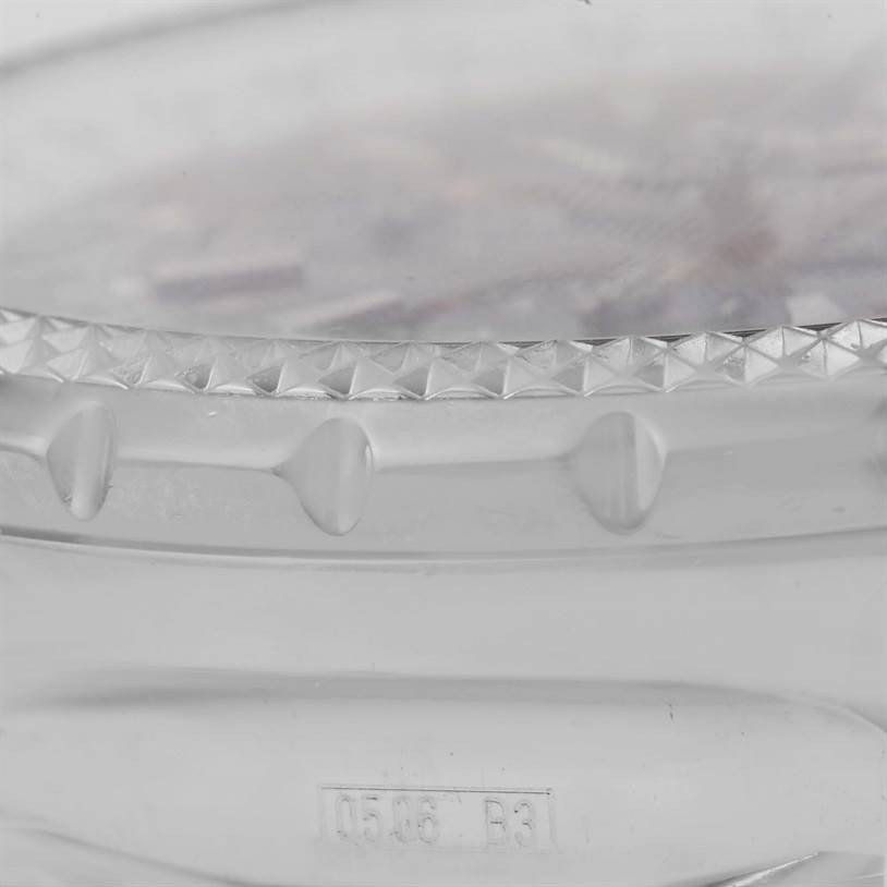 This image shows a close-up of the bezel and part of the case of a Bentley model by Breitling.