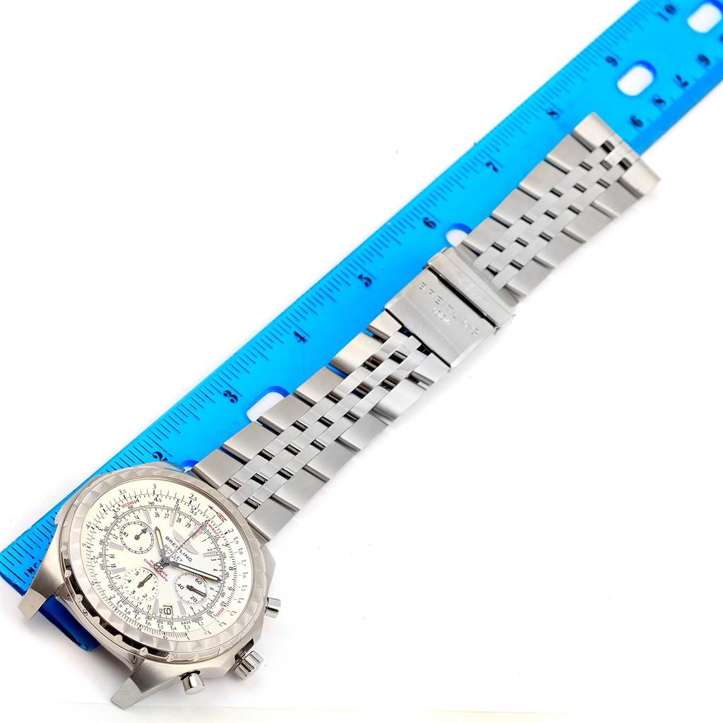 The Breitling Bentley A25363 Men's Stainless Steel White Dial A25363 Men's Stainless Steel White Dial watch is shown from a top-down angle with a blue ruler measuring its silver metal bracelet.