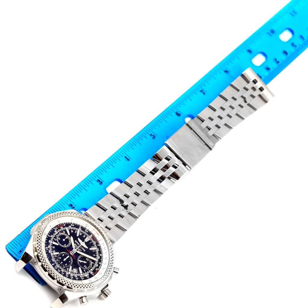 The image shows a top view of the Breitling Bentley A25362 Men's Stainless Steel Black Dial A25362 Men's Stainless Steel Black Dial watch with a blue ruler measuring the metal strap.