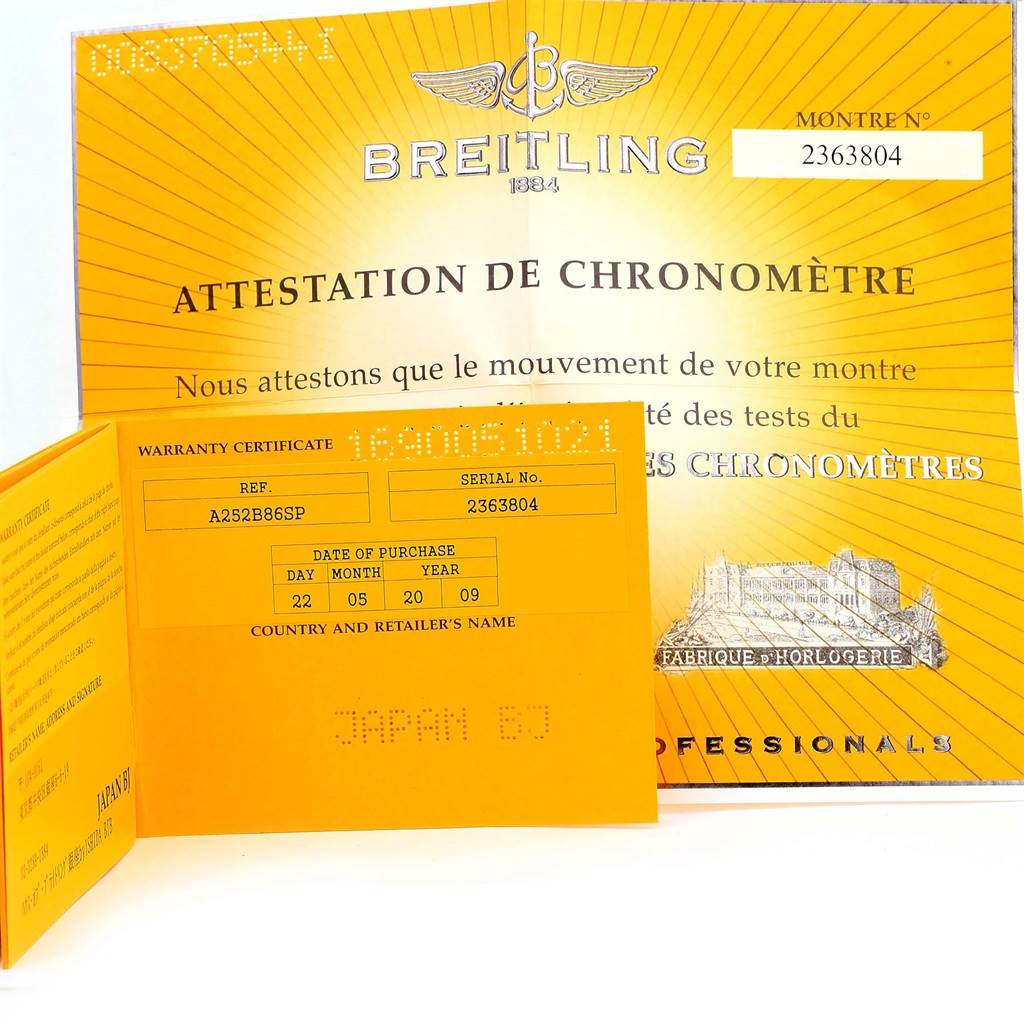 The image shows warranty certificates and chronometer attestation documents for a Bentley model by Breitling.