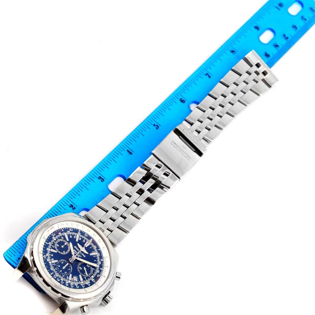 The image shows a Breitling Bentley A25362 Men's Stainless Steel Blue Dial A25362 Men's Stainless Steel Blue Dial watch laid flat with its bracelet extended alongside a blue ruler for scale.