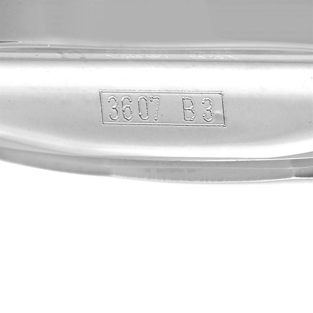 This image shows a close-up of the engraved serial number "3607 B3" on a Bentley model by Breitling.