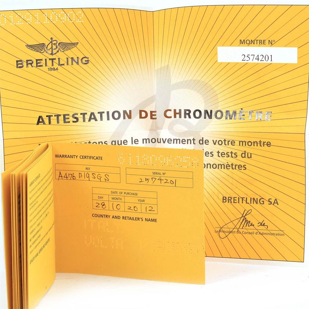 The image shows warranty paperwork and a chronometer certificate for a Bentley model by Breitling.