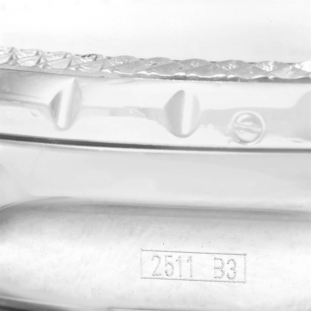 The image shows a close-up of the side of a Breitling Bentley A25362 Men
s Stainless Steel Black Dial A25362 Men
s Stainless Steel Black Dial watch, highlighting its bezel and engravings.