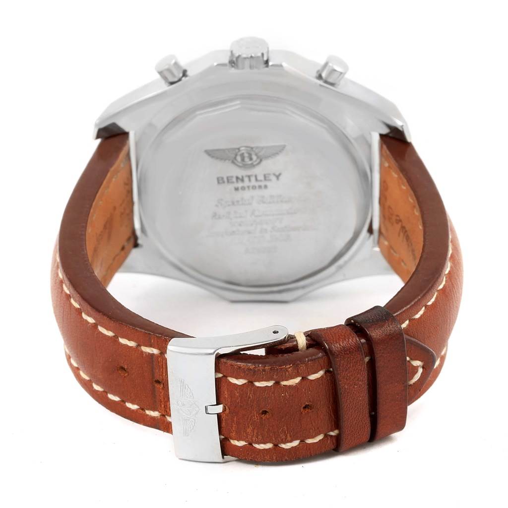The image shows the back view of a Bentley model watch by Breitling, featuring its case back, brown leather strap, and clasp.