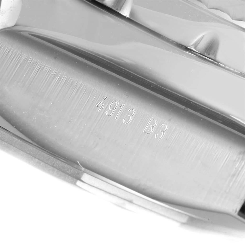 The image shows a close-up of the case-back edge featuring engraved numbers on the Breitling Bentley AB0431 Men's Stainless Steel Silver Dial AB0431 Men's Stainless Steel Silver Dial model watch.