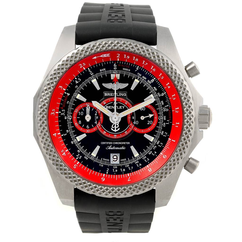 The image shows a Breitling Bentley E27365 Men's Titanium Black Dial E27365 Men's Titanium Black Dial watch with a black rubber strap, a textured silver bezel, and a red and black dial.