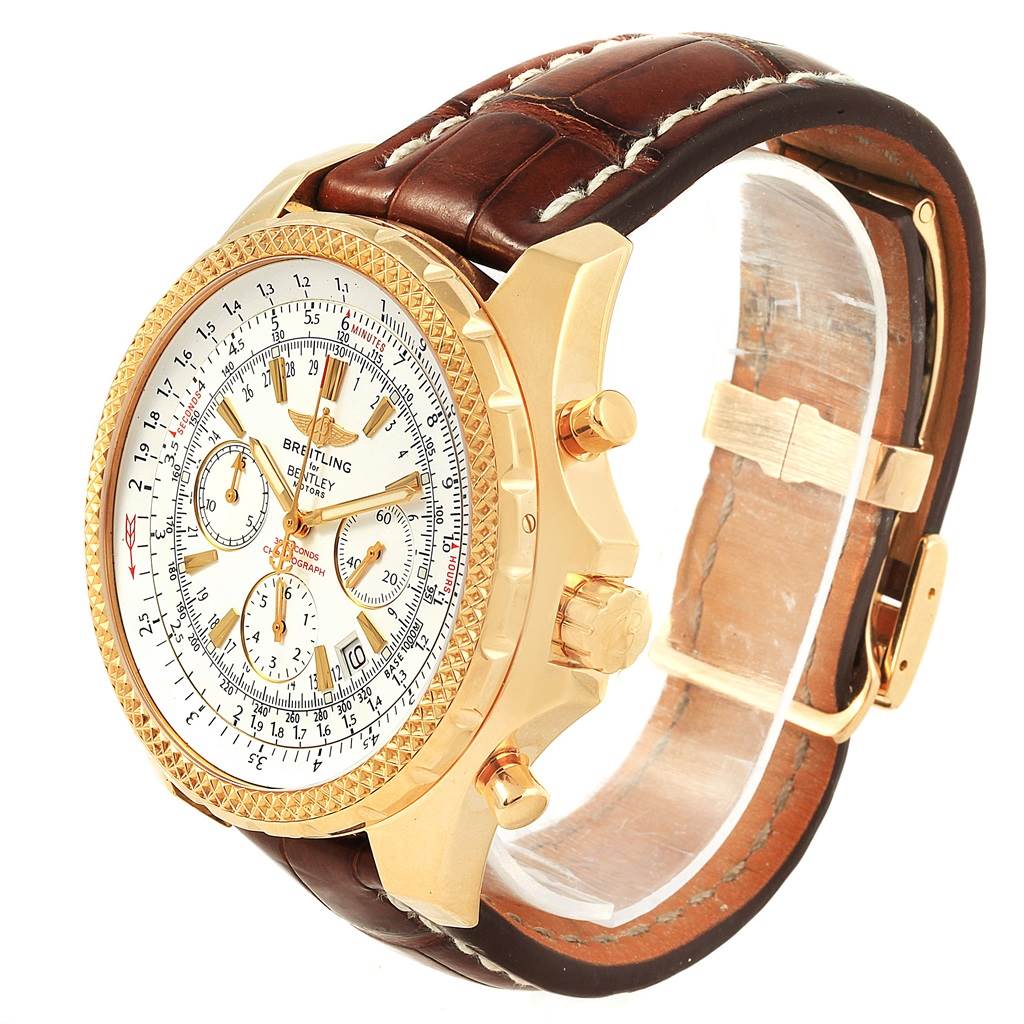 The Breitling Bentley K25362 Men's Steel and Gold (two tone) White Dial K25362 Men's Steel and Gold (two tone) White Dial watch is shown at a three-quarter angle, highlighting the gold casing, white dial, and brown leather strap.