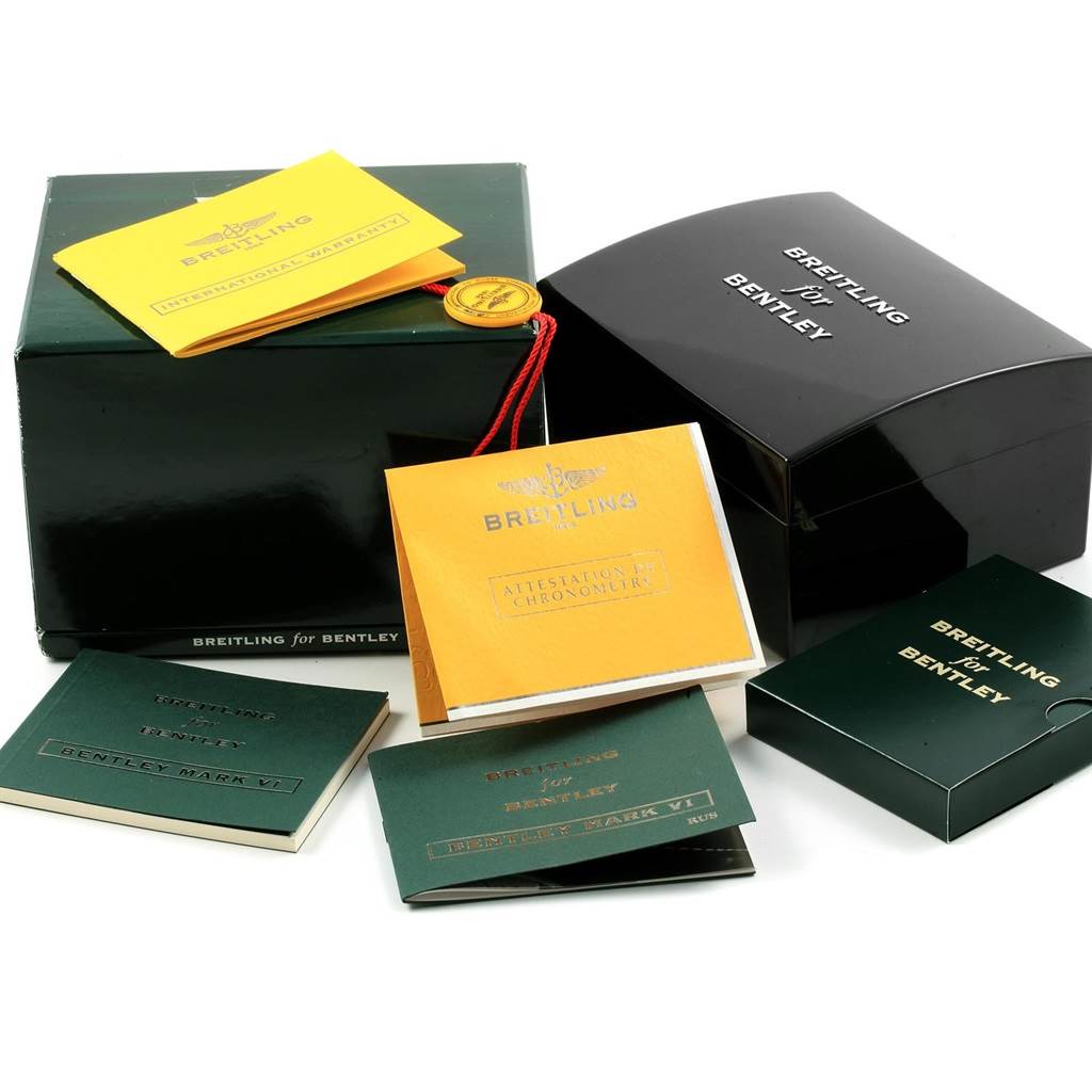 The image shows the packaging and documentation for the Bentley model by Breitling, including boxes, manuals, and warranty papers.