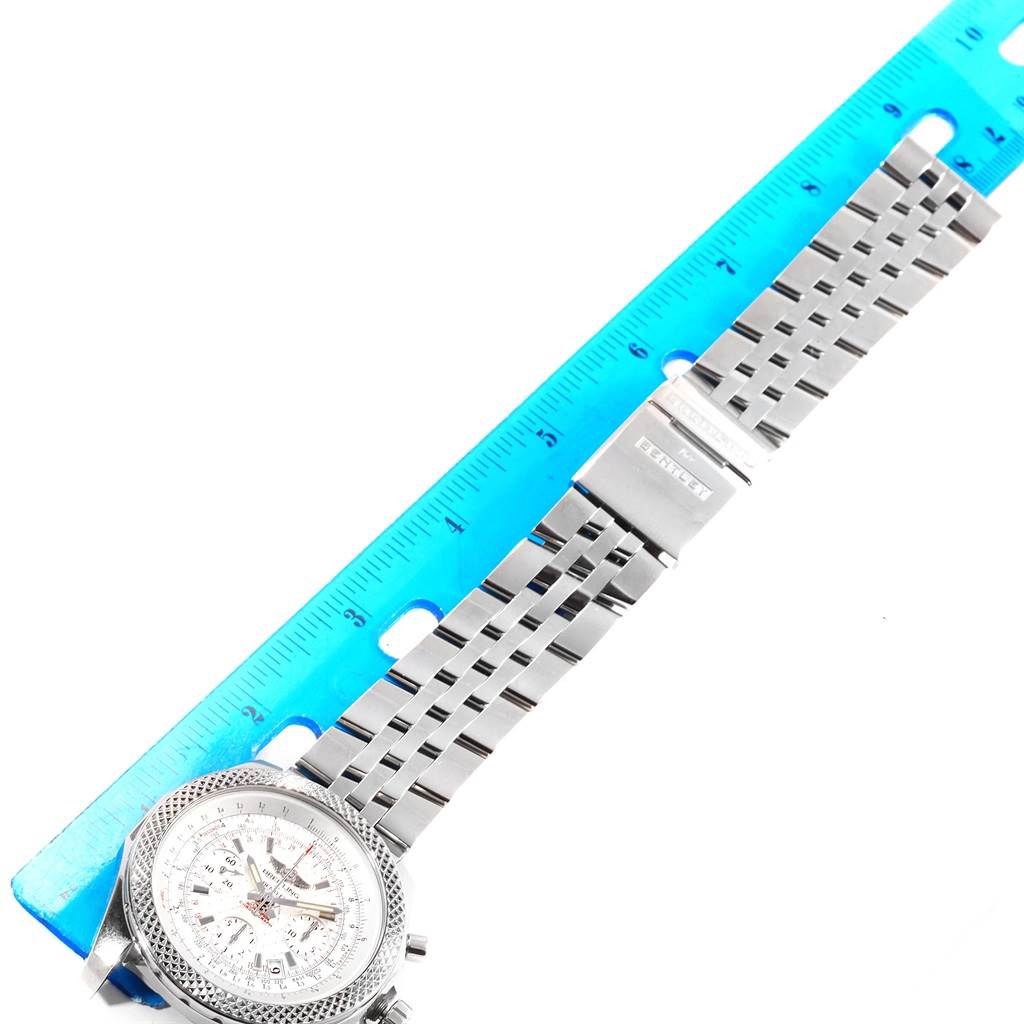 The image shows a Bentley model by Breitling watch from an angled top view, highlighting its face and bracelet, alongside a ruler for scale.