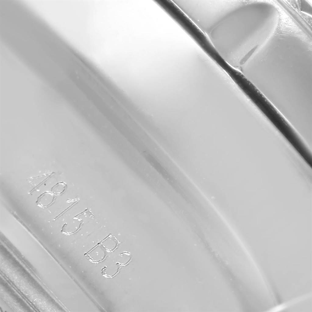 The image shows a close-up of the inner band of a Breitling Bentley AB061221/G810-980A Men
s Stainless Steel Silver Dial AB061221/G810-980A Men
s Stainless Steel Silver Dial watch, featuring engraved serial numbers.