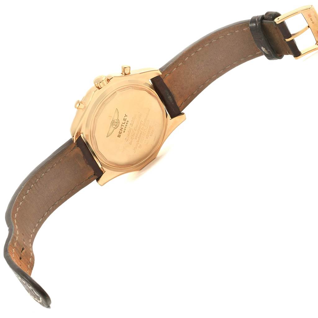 The image shows the backside and leather strap of a Bentley model watch by Breitling, highlighting the engraved case back.