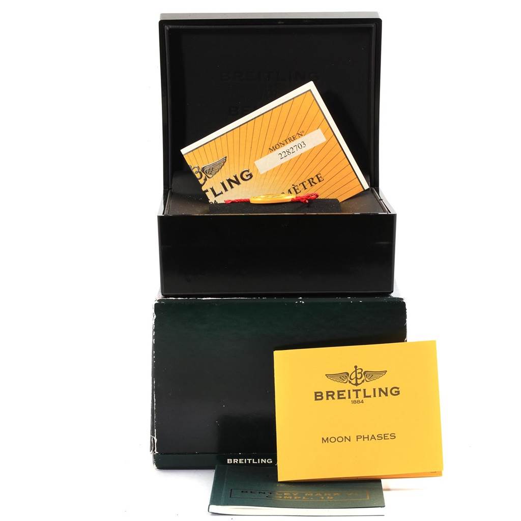 The image shows packaging and documentation for the Bentley model by Breitling, including manuals and a box, all from a front angle.