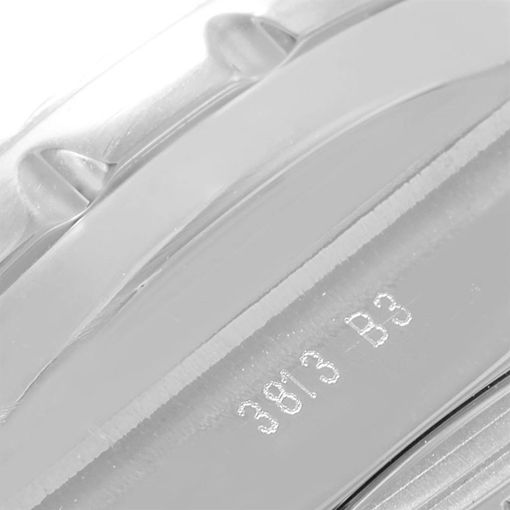 This is a close-up shot of the outer case and bezel edge of the Breitling Bentley AB061112-G802-754P Men's Stainless Steel Silver Dial AB061112-G802-754P Men's Stainless Steel Silver Dial watch, showing part of the stamped serial number.
