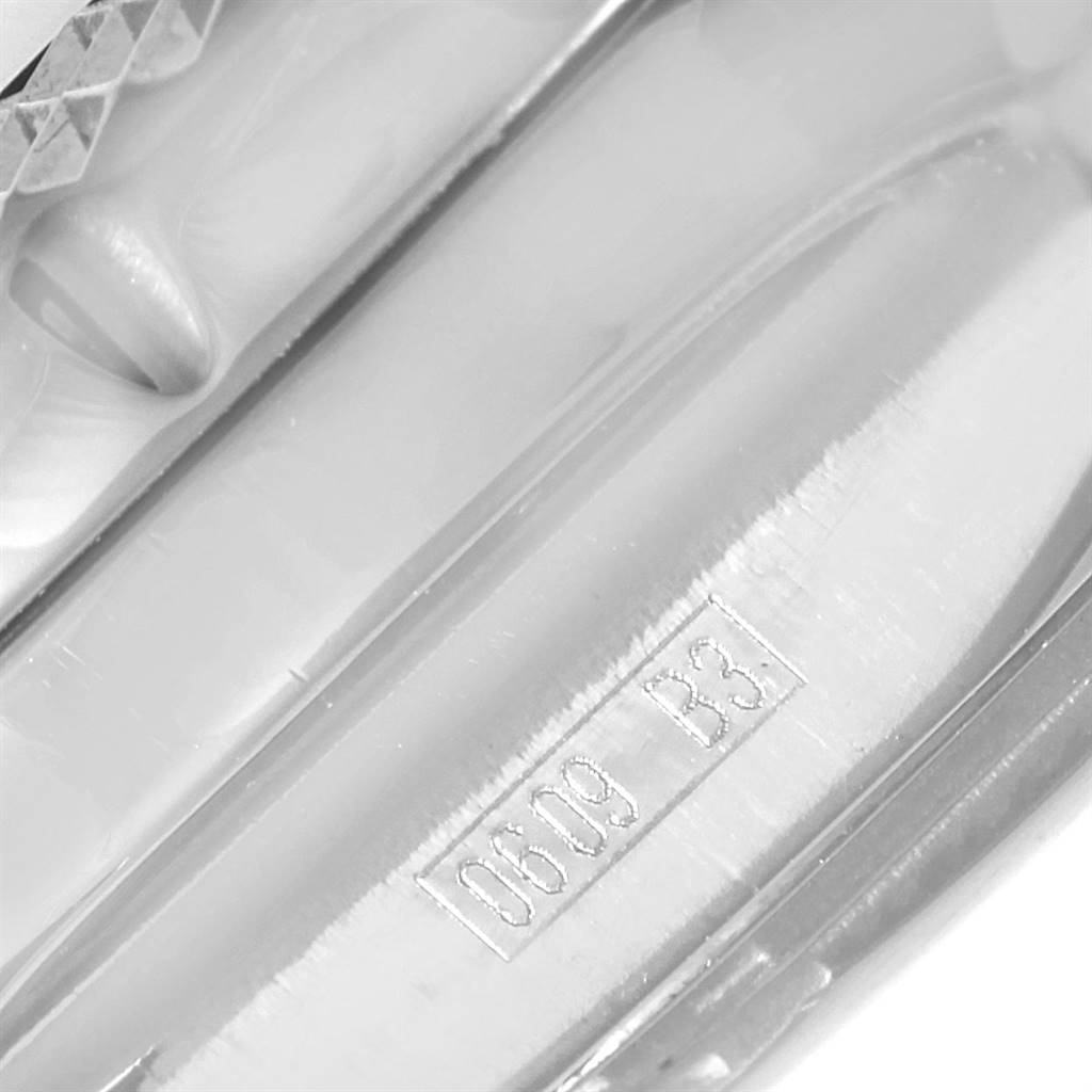 This image shows a close-up of the metal strap clasp of a Bentley model Breitling watch, focusing on the engraved numbers.