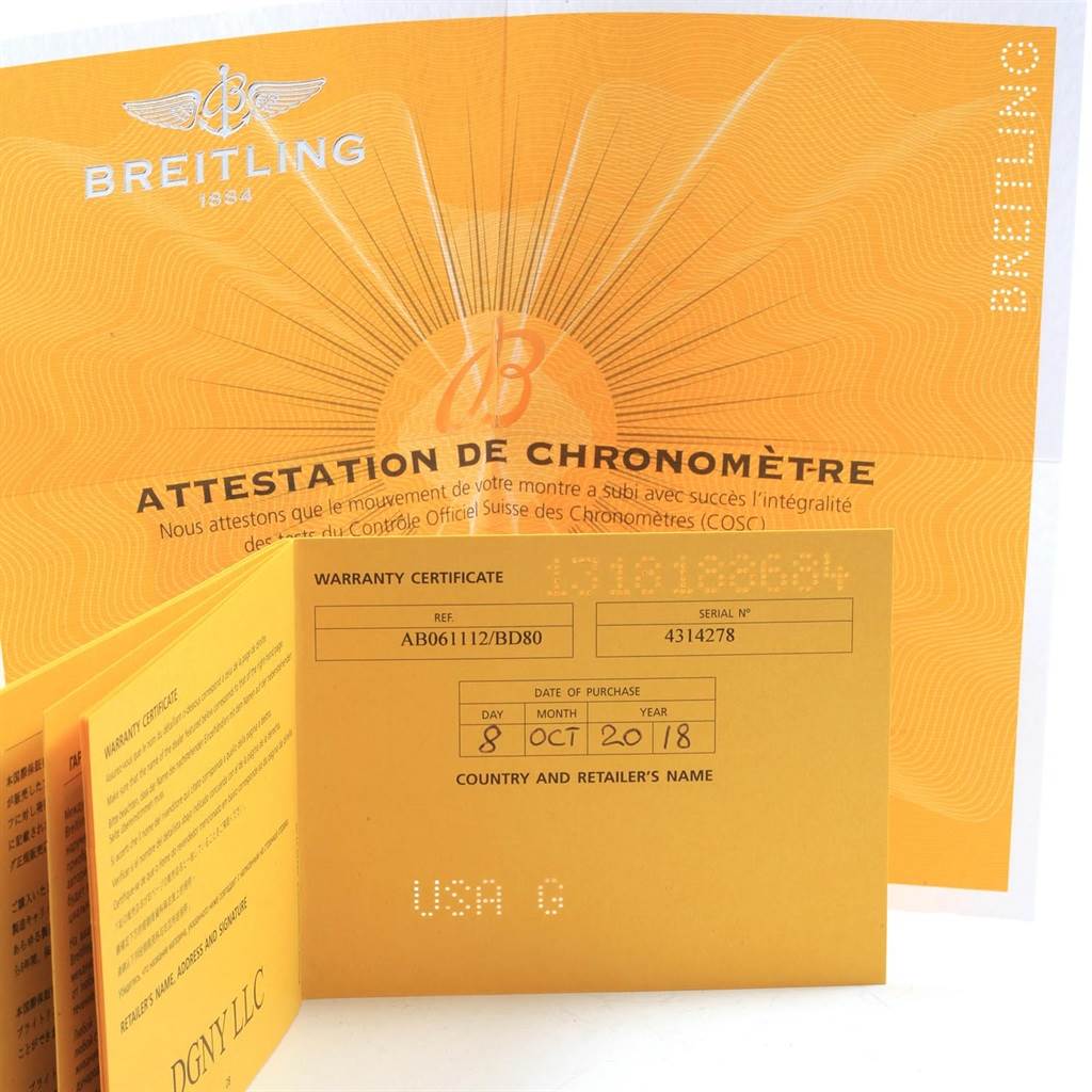 The image shows warranty certificates and other documentation for a Breitling Bentley AB061112.BD80.990A Men's Stainless Steel Black Dial AB061112.BD80.990A Men's Stainless Steel Black Dial model watch.