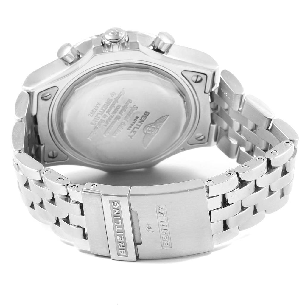 The image shows the back case and clasp of a Bentley model by Breitling, highlighting the engravings and stainless steel bracelet.