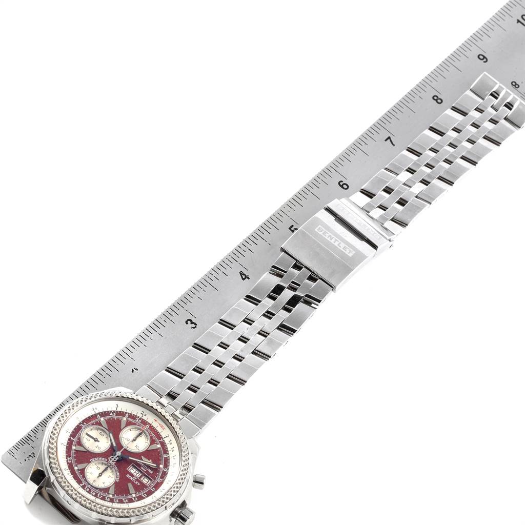 The image shows a Bentley model by Breitling, displaying the watch face, metal bracelet, and clasp, measured alongside a ruler.