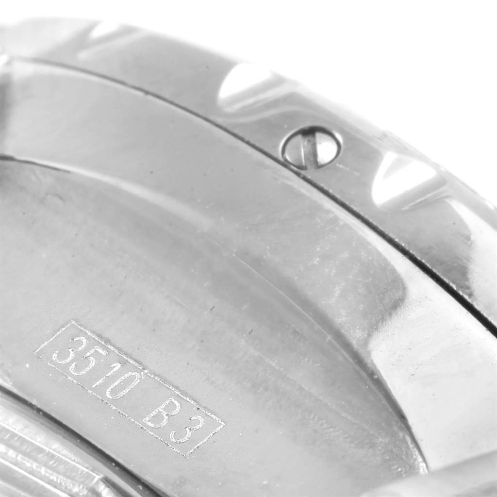 The image shows a close-up of the bezel and case back of a Breitling Bentley A13362 Men's Stainless Steel Burgundy Dial A13362 Men's Stainless Steel Burgundy Dial model watch, featuring a screw and engraved serial number.