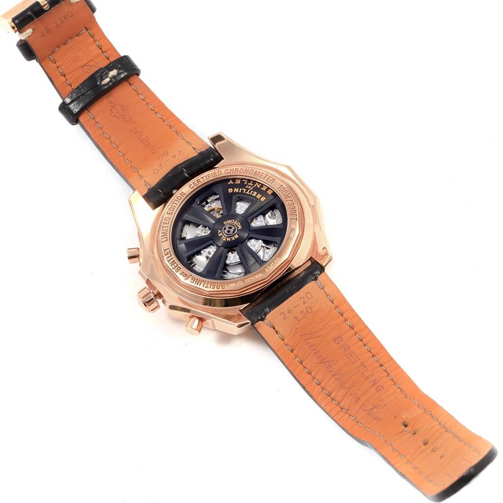The image shows the back case and leather straps of a Breitling Bentley R25366 Men's Rose Gold Black Dial R25366 Men's Rose Gold Black Dial watch, highlighting its inner mechanics and branding.