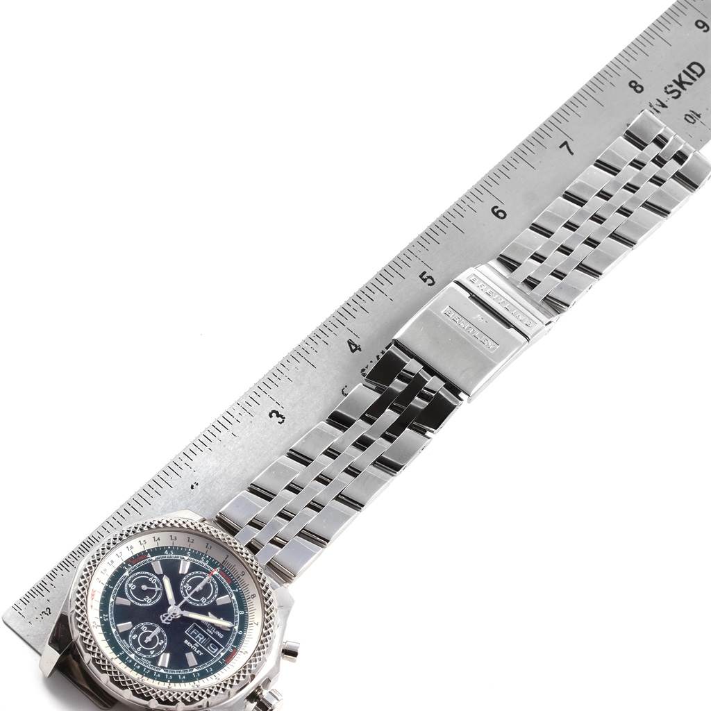 The image shows a Breitling Bentley A13365 Men
s Stainless Steel Green Dial A13365 Men
s Stainless Steel Green Dial watch laid flat, displaying its face, metal bracelet, and clasp next to a ruler for scale.