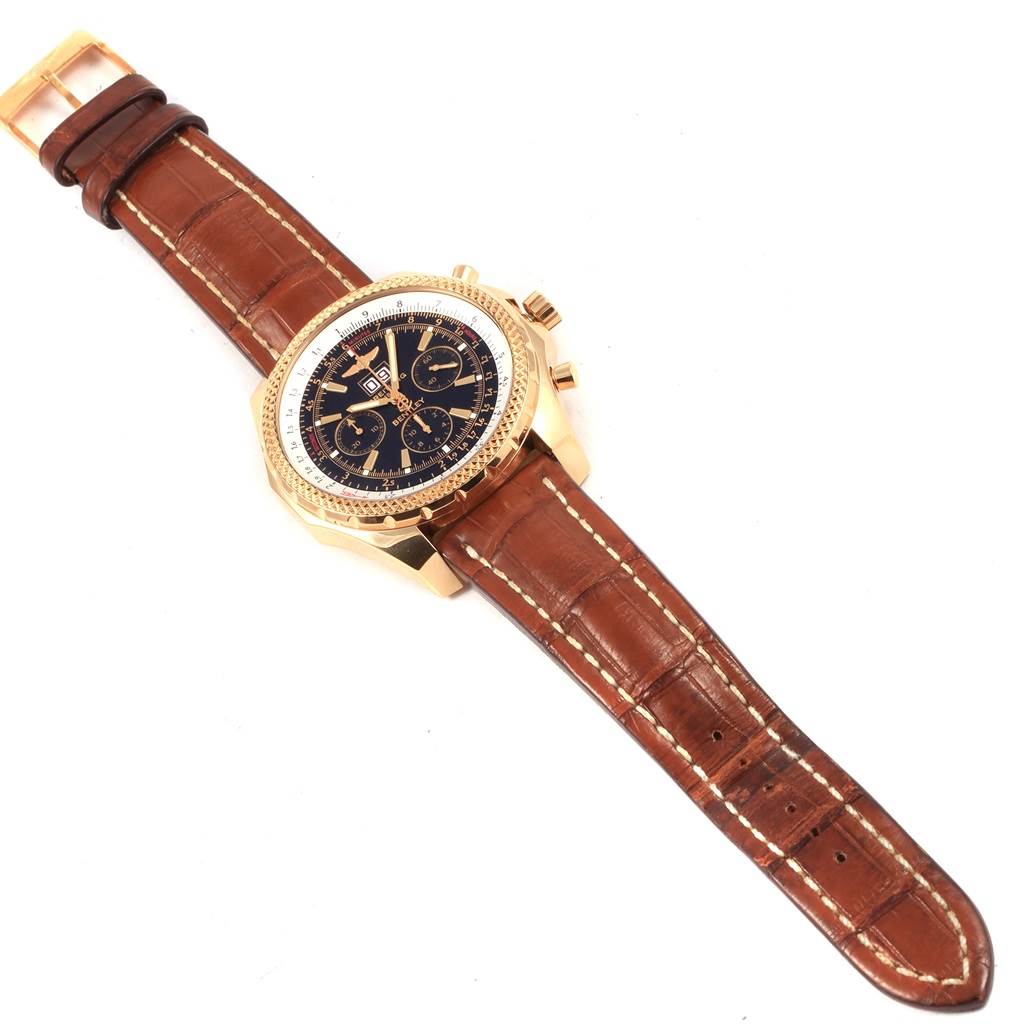 The image shows a Breitling Bentley K44362 Men's Yellow Gold Black Dial K44362 Men's Yellow Gold Black Dial model watch at an angle highlighting its face, brown leather strap, and gold case.