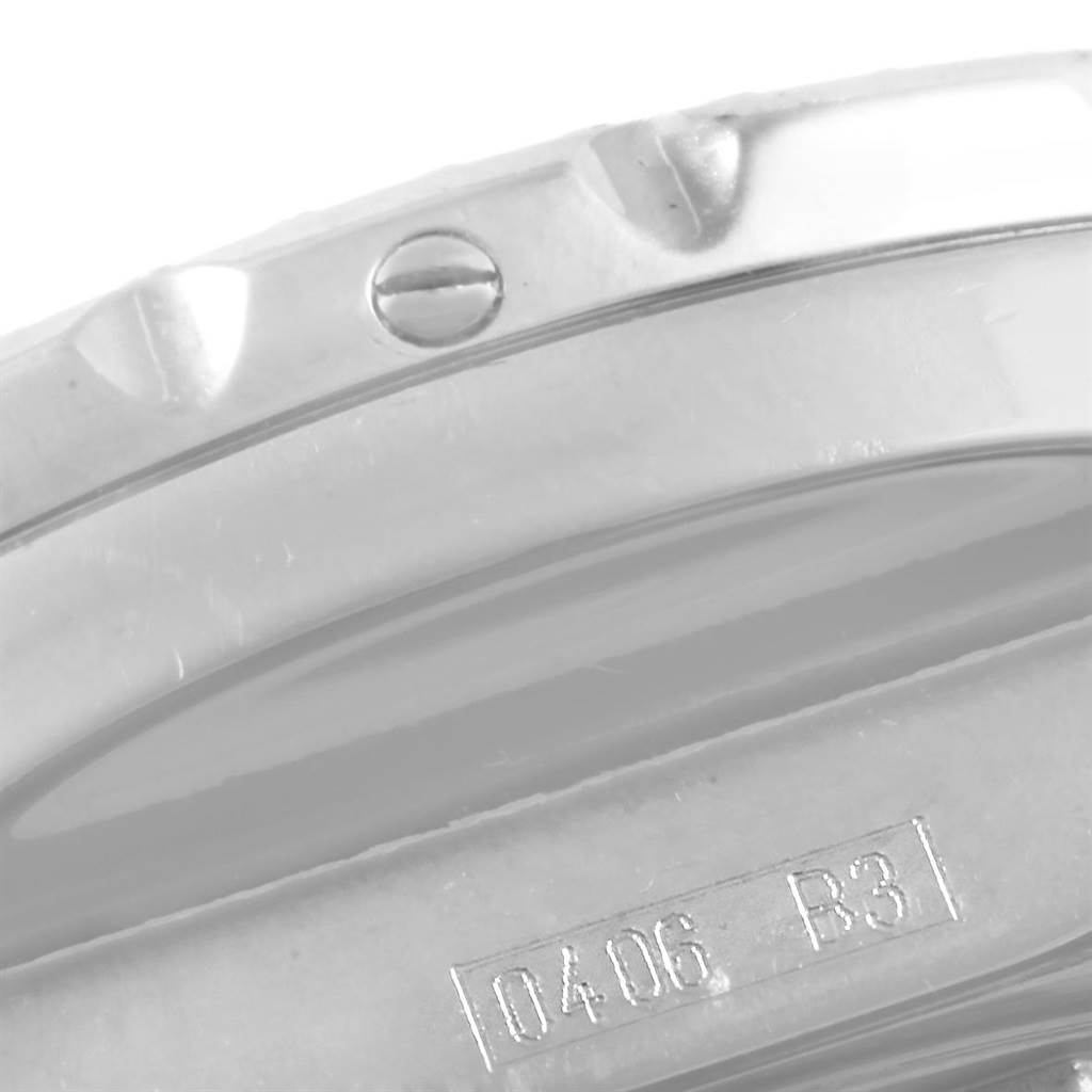 This close-up image of the Breitling Bentley A13363 Men's Stainless Steel Blue Dial A13363 Men's Stainless Steel Blue Dial watch shows the side angle with details of the bezel and engraved serial number.