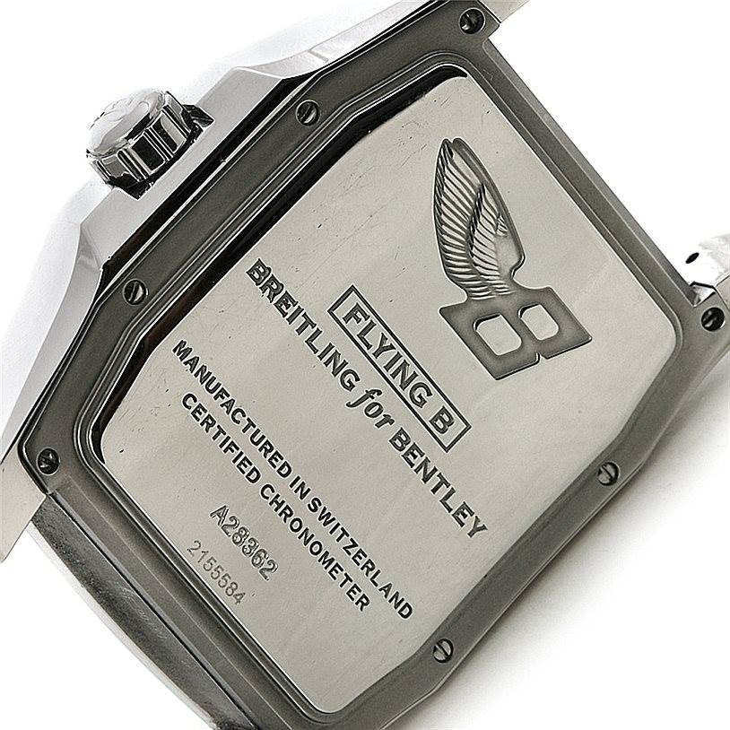 The image shows the back case and crown of a Bentley model watch by Breitling, highlighting the engraved details.