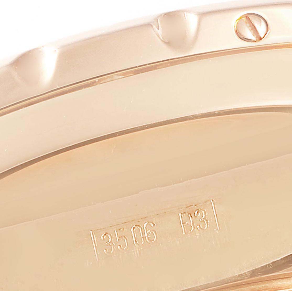 This close-up image shows the edge of the bezel and part of the case of a Bentley model watch by Breitling, featuring a screw and engraved markings.