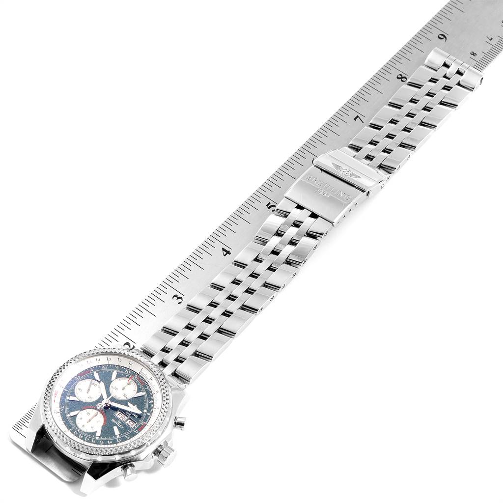 The image shows a top-down view of a Breitling Bentley A13362 Men
s Stainless Steel Green Dial A13362 Men
s Stainless Steel Green Dial model watch with its full metal bracelet against a measuring ruler.