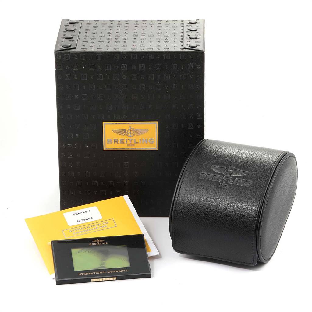 The image shows the packaging and accessories for a Bentley model by Breitling, including a box, warranty card, and watch case.