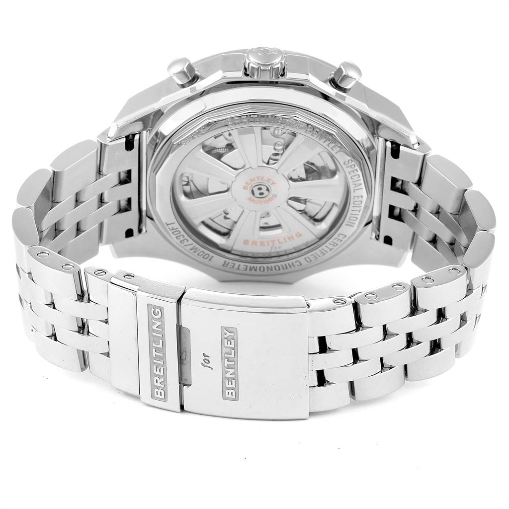 The image shows the back case and clasp of a Breitling for Bentley watch, highlighting the metal bracelet and visible movement.