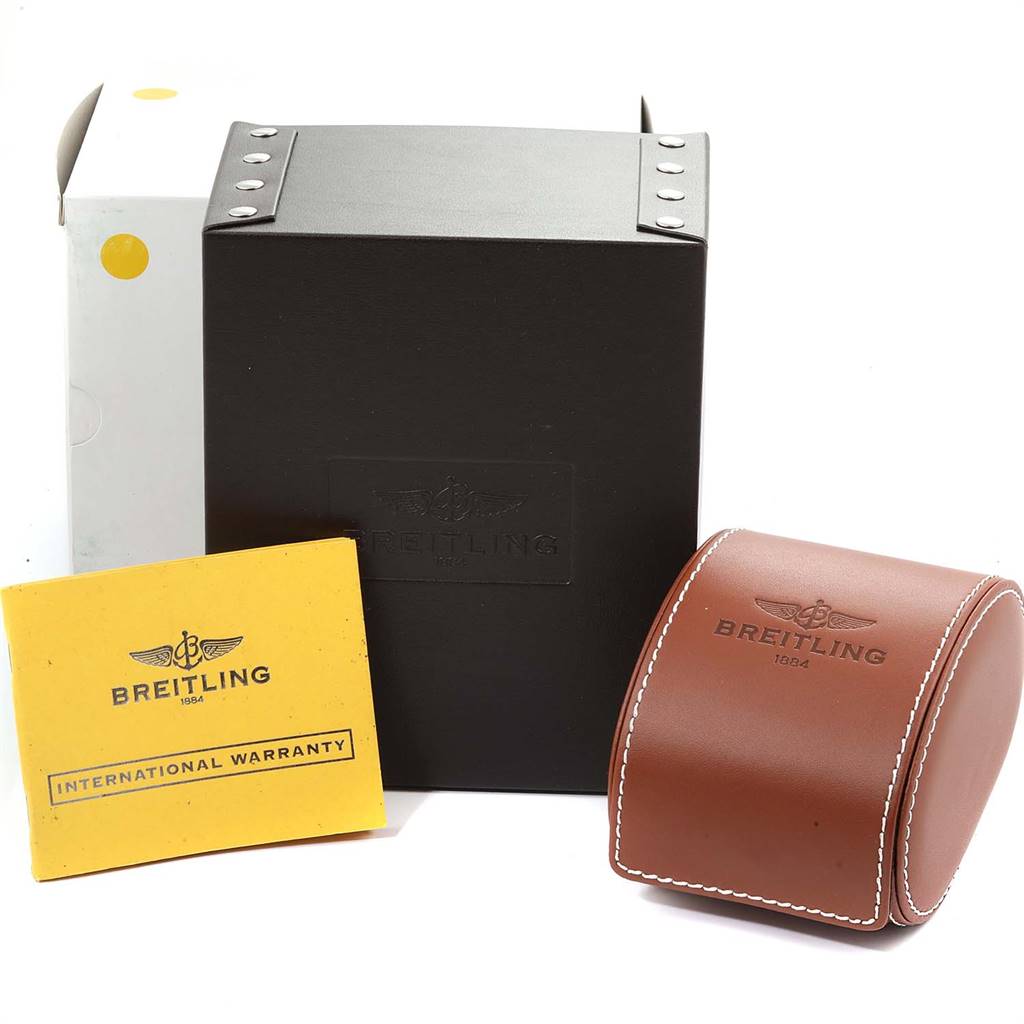 The image shows the accessories of a Bentley watch by Breitling, including its box, warranty card, and a leather case.