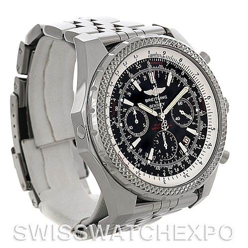 The image shows a Breitling watch with a black dial, taken at an angled side view, displaying the case, bezel, and part of the bracelet.