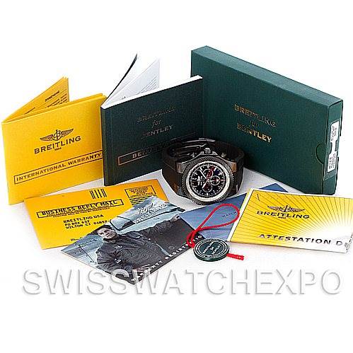The image shows the Bentley model by Breitling with its box, manual, warranty, and other accessories laid out flat.