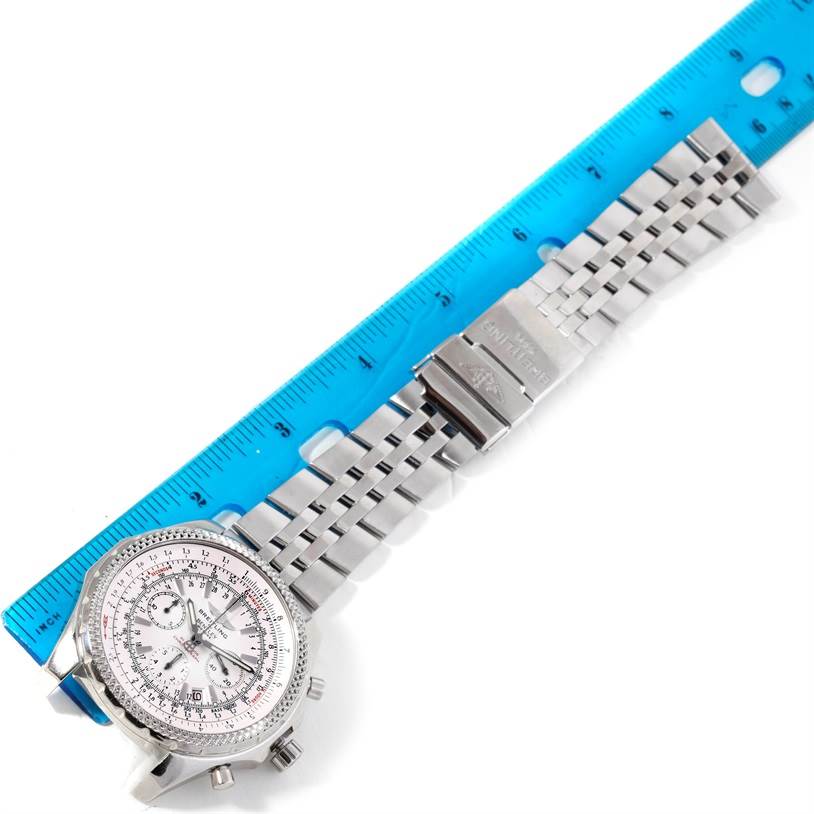The image shows a top-down view of a Breitling Bentley A25362 Men
s Stainless Steel White Dial A25362 Men
s Stainless Steel White Dial model watch alongside a ruler, highlighting its face and metal strap.