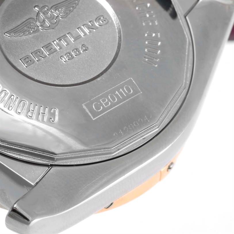 This image shows the back case of a Breitling Chronomat CB0110 Men's Steel and Gold (two tone) Blue Dial CB0110 Men's Steel and Gold (two tone) Blue Dial watch, featuring brand engravings and reference numbers.